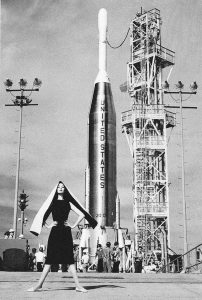 Supermodel Dovima posing beside an Atlas-Able rocket, 1959.