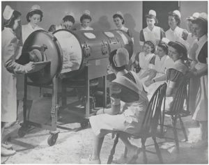 Nurses learning how to use a respirator for polio patients, 1958. 