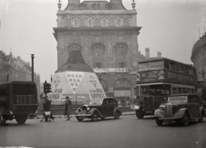 War Savings posters cover the sand-bagged and boarded Eros in London's Piccadilly Circus. London 1941 