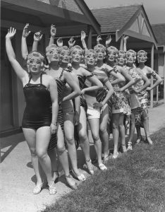 Beauty contestants wearing Marilyn Monroe masks, beauty standard, 1952.