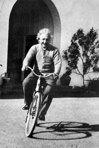 Albert Einstein riding a bicycle in sunny California, 1933.