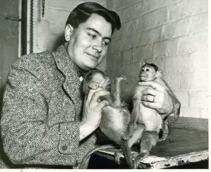 Jim Jones, cult leader, pictured with two monkeys, date unknown.