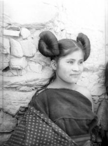 Young Hopi Indian maiden in traditional hairstyle, 1910.