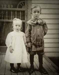 5 year old Walt Disney poses with his 3 year old sister Ruth, 1906. 