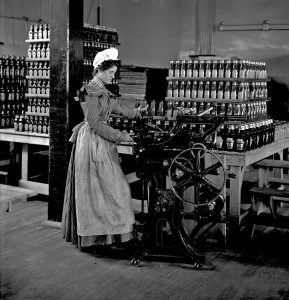 Bottling ketchup at the original Heinz factory, circa 1898.