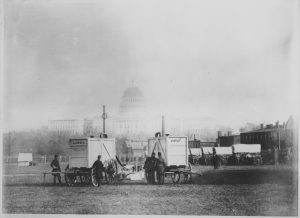 Portable hydrogen generators of Chief Aeronaut Thaddeus Lowe prepare for a manned demonstration flight of a balloon in front of the US Capitol building, 1861. 