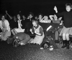 Female fans, overtaken by the intensity of watching The Beatles, 1963.